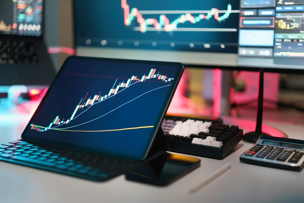 pexels-photo-30381207-30381207 A comprehensive setup featuring digital trading platforms with charts and graphs for financial analysis.