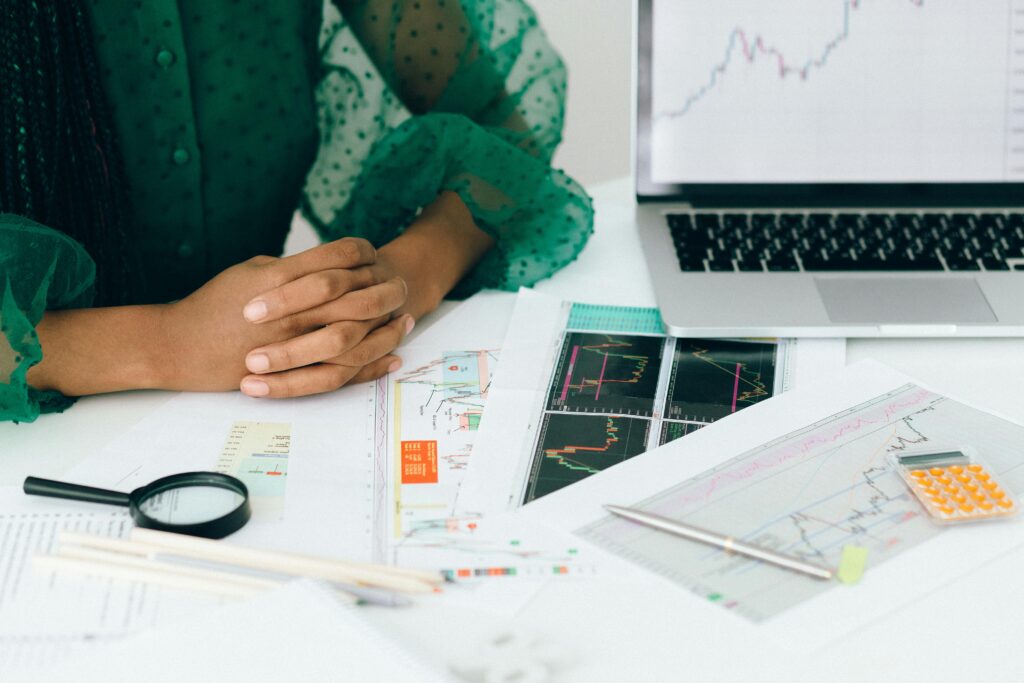 pexels-photo-7172830-7172830 A person analyzes financial charts and graphs at a desk, indicating business trading activity.